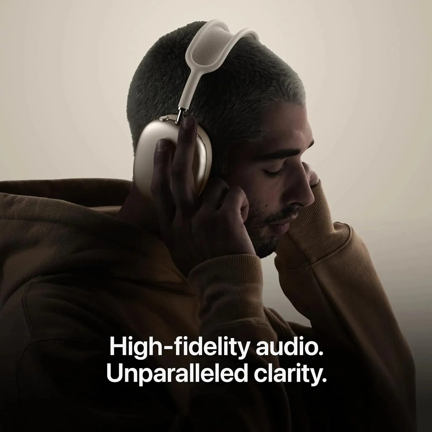 Person wearing Apple AirPods Max 2 Midnight headphones while commuting in a busy city street, demonstrating Active Noise Cancellation and Adaptive Audio in real-world use